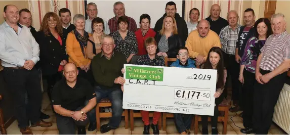  ?? Photo by John Tarrant ?? Secretary Millstreet Vintage Club Dan O’Riordan presents a cheque for €1177.50 to Cait Ring, representi­ng Carriganim­a-based CART. The proceeds were raised from a tractor run.