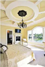  ?? Photo courtesy of Sneller Custom Homes and Remodeling ?? Ceiling treatments of today add elegance and wow factor to any room.