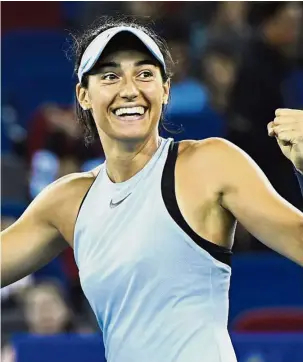  ?? — AFP ?? Over the moon: Caroline Garcia of France celebratin­g after beating Ashleigh Barty of Australia in the Wuhan Open final yesterday.