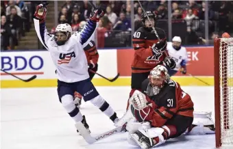  ?? ASSOCIATED PRESS ?? RAISING HER GAME: Brianna Decker celebrates after scoring on Canada goalie Genevieve Lacasse during Thursday’s Rivalry Series battle in Toronto.