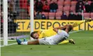  ??  ?? Bryan Mbeumo slides in at the back post but can only divert Brentford’s low cross wide of Asmir Begovic’s goal. Photograph: Mike Hewitt/Getty Images