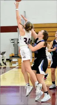  ?? PILOT PHOTO/BEV HARAMIA ?? CGA’S Kennedi Leeper gets fouled on this drive to the basket by Laville’s Lucy Sherk. Leeper finished with 11 points in the Lady Eagles’ win over the Lady Lancers.