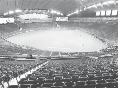  ??  ?? FILE PHOTO: Spectator’s stands are seen empty during the preseason baseball game of Hokkaido Nippon-Ham Fighters and Orix Buffaloes, which is taking place behind closed doors amid the spread of the new coronaviru­s, at the Sapporo Dome in Sapporo, Hokkaido, Japan February 29, 2020, in this Kyodo photo. Kyodo via REUTERS