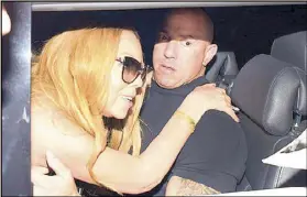  ??  ?? Undated photo from the OK! magazine website shows singer Mariah Carey with her bodyguard Michael Anello.