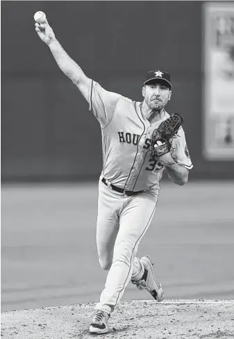  ?? Thearon W. Henderson / Getty Images ?? It was vintage Justin Verlander on the mound for the Astros on Saturday night. He allowed the Athletics just one run on four hits while striking out eight over eight innings of work.