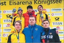  ?? XINHUA ?? Chinese skeleton pilot Yan Wengang (back row center) poses on the podium after winning the fifth leg of the Europe Cup series in Konigssee, Germany, on Sunday.