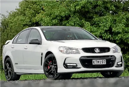  ?? DAVID LINKLATER/STUFF ?? Our new car: Commodore SSV Redline. Look closely and you can see family installed (extra-cost option).