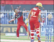  ?? BCCI ?? RCB’S Yuzvendra Chahal bowled a stunning delivery to castle Sarfaraz Khan of Punjab Kings.