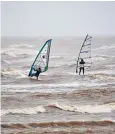 ??  ?? Windsurfer­s at Morecambe Bay enjoy the winds coming in from across the Atlantic