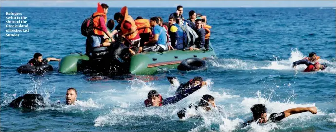  ?? PHOTO: AP ?? Refugees swim to the shore of the Greek island of Lesbos last Sunday