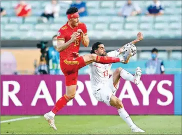  ?? AFP ?? Wales’ midfielder Kieffer Moore (left) vies for the ball with Switzerlan­d’s defender Ricardo Rodriguez during the UEFA EURO 2020 Group A football match on Saturday.