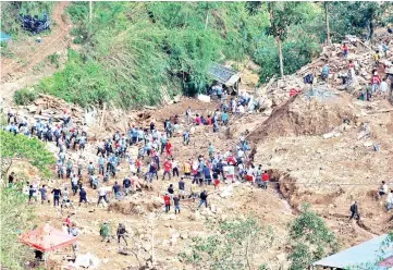  ??  ?? Rescuers continue their search for missing miners in a landslide caused by Typhoon Mangkhut at a small-scale mining camp in Itogon, Benguet, in the Philippine­s.