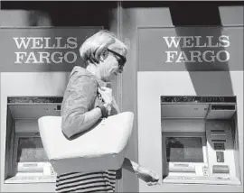  ?? Frederic J Brown AFP/Getty Images ?? WELLS FARGO has argued that arbitratio­n clauses signed by customers in opening genuine accounts covered all disputes with the bank. Above, in Pasadena.