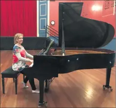  ??  ?? GRAND: SPACI member Alanis Williams plays a tune on Stawell Performing Arts Company’s grand piano.