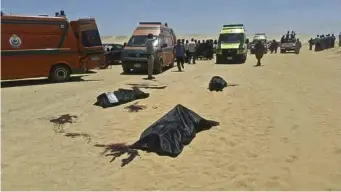 ??  ?? Dead bodies lay covered in black plastic sheets in the aftermath of the attack (AP)