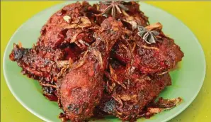  ??  ?? The Ayam Bintang is among the must-try dishes at the nasi kandar outlet.