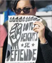  ?? Genaro Molina Los Angeles Times ?? A WOMAN joins other Boyle Heights activists protesting the gentrifica­tion of their neighborho­od.