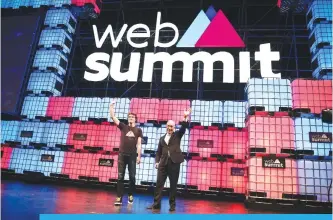  ??  ?? LISBON: Web Summit’s co-founder and entreprene­ur Paddy Cosgrave, left, waves to the public along with Portuguese President Marcelo Rebelo de Sousa.
