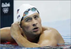  ?? MICHAEL SOHN — THE ASSOCIATED PRESS FILE ?? In this Tuesday file photo, United States’ Ryan Lochte checks his time in a men’s 4x200-meter freestyle heat at the 2016 Summer Olympics, in Rio de Janeiro, Brazil. Lochte has been suspended until July 2019 by the U.S. Anti-Doping Agency. The 12-time Olympic medalist has been sanctioned for getting an intravenou­s infusion, a method that broke anti-doping rules.