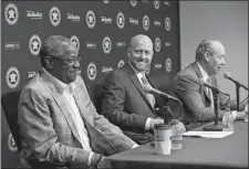  ?? JON SHAPLEY/HOUSTON CHRONICLE/AP PHOTO ?? James Click, center, the newly-hired Houston Astros general manager, laughs with as Astros manager Dusty Baker, left, as Astros owner and chairman Jim Crane speaks about Click during a press conference on Tuesday at Minute Maid Park in Houston.