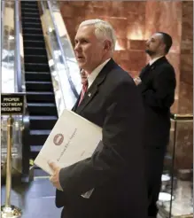  ?? AP file photo ?? Then-Vice President-elect Mike Pence carries a briefing binder as he arrives at Trump Tower, Nov. 15, 2016, in New York. The discovery of classified documents at the home of Pence is scrambling the blame game in Washington. Now, lawmakers from both parties seem united in frustratio­n with the string of mishaps in the handling of the U.S. government’s secrets.