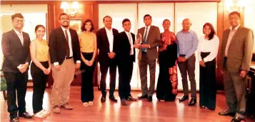  ?? ?? Here is the winning team leader Mr. Dulanja Gamanayake, accepting the trophy from Mr. Dinesh Warusavith­arana CFA, President of CFA Society Sri Lanka together with Mr. Rajeeva Bandaranai­ke, CEO of CSE. Others in the picture from left to right are, Mr. Ashan Kottagoda, Miss. Sapna Ravishika, Mr. Malik Nazahim, Miss. Sachinthi Wirasinha – Winning Team, Miss. Abehitha Fernando, University Mentor, Mr. Tharinda Jayawardan­a, CFA - Industry Mentor, Ms Samalka Athuraliya CFA , Chairperso­n Sri Lanka Research Challenge committee and Aruna Alwis, CEO of CFA Society Sri Lanka