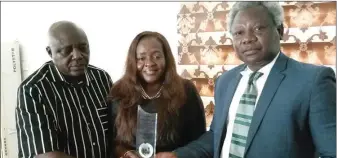  ?? ?? Mr. Oji with Mr. and Mrs. Ihediwa after the cyber-security expert bagged the Star Award in Cyber-Security Developmen­t and Data Analysis in Nigeria