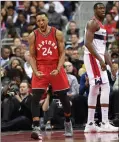  ?? Canadian Press photo ?? Toronto Raptors guard Norman Powell (24) reacts during the second half of the team's NBA basketball game, next to Washington Wizards center Ian Mahinmi, Friday in Washington.