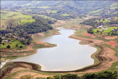  ?? The Washington Post/DOM PHILLIPS ?? is the highest of five lakes that supply water to 6.5 million people in Sao Paulo, Brazil. The lakes have shrunk to about a 10th of their normal levels.