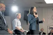  ?? Rachel Woolf, The Denver Post ?? Colorado Secretary of State Jena Griswold speaks as moderator Omar Montgomery, left, and 2020 presidenti­al candidate Tom Steyer participat­e in a town hall on democracy issues at IBEW Local 111 on Dec. 29.