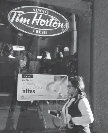  ?? DOUG IVES/THE CANADIAN PRESS ?? Tim Hortons lagged its corporate sibling Burger King in second-quarter results, citing softer lunch and baked goods sales and lacklustre customer response to limited-time offers.
