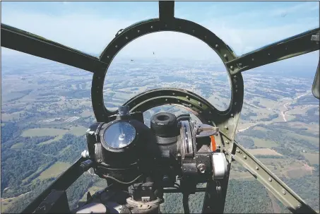  ?? NWA Democrat-Gazette/LAURINDA JOENKS ?? The view of the Ozarks from the forward bombardier’s seat in the B-29 Superfortr­ess Fifi is obscured only by a Norden bomb sight. Also mounted nearby was a sight for 50-caliber guns mounted above and below the aircraft and operated remotely during...