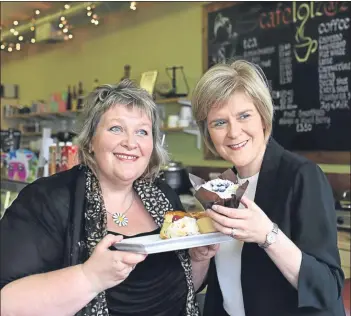  ?? Picture: Allan Milligan. ?? Deputy First Minister Nicola Sturgeon visited Kirkwall on Orkney and stopped for a bite to eat with Lorraine Tait of Cafe Loiz.