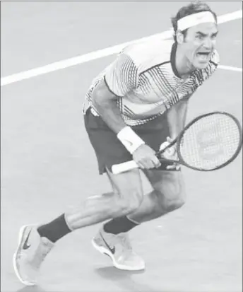  ??  ?? Switzerlan­d’s Roger Federer is ecstatic after defeating Rafael Nadal to win the men’s singles title at the Australia Open yesterday. (Reuters photo)