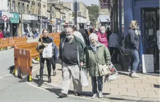  ??  ?? CLOCKWISE FROM TOP LEFT: Manager of Merry England in Brighouse, Holly Brophy; Gary Taylor of Edward & Co (both pics by Steven Lord); Businesses at the Piece Hall have re-opened their doors (two pics by Stephen Bullock, third by Jim Fitton); Shoppers in Brighouse.