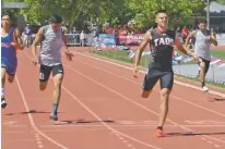  ?? PHOTOS BY JAMES BARRON THE NEW MEXICAN ?? LEFT: Taos senior Jonah Vigil beats the Class 4A field in the 400 meters Saturday.