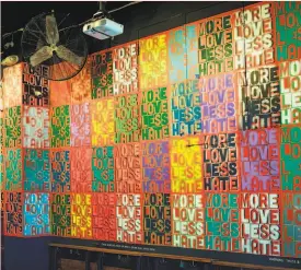  ?? Mike Spike Krouse ?? One wall of Madrone Art Bar has Krause’s “More Love Less Hate” stenciled in different colors.