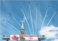  ?? JUSTIN TANG THE CANADIAN PRESS FILE PHOTO ?? Royal Canadian Air Force Snowbirds fly past the Peace Tower during the Canada Day noon show on Parliament Hill last July 1.