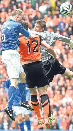  ?? Picture: SNS. ?? Steven Anderson climbs above Dundee United pair Keith Watson and Rado Czerniak to head St Johnstone into the lead in the 2014 Scottish Cup final at Celtic Park.