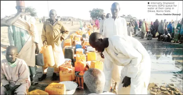  ?? Photo: Omirin Olatunji ?? Internally Displaced Persons (IDPs) queue for water at their camp in Dikwa, Borno State.