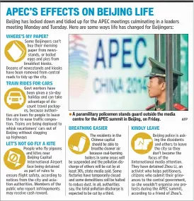  ?? AFP ?? A paramilita­ry policemen stands guard outside the media centre for the APEC summit in Beijing, on Friday.