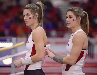  ?? (NWA Democrat-Gazette/Ben Goff) ?? Twin sisters Tori Hoggard (left) and Lexi Jacobus, shown competing for Arkansas in 2016, completed their Razorbacks careers with a combined five NCAA and seven SEC titles. The pole vaulters plan to train for the Olympics while attending pharmacy school.