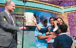  ?? ALEX BRANDON/AP ?? Harini Logan celebrates with her family Thursday after winning the Scripps National Spelling Bee in Maryland. It’s the first national title for the 14-year-old Texan.