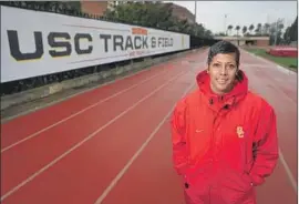  ?? Allen J. Schaben Los Angeles Times By Lindsey Thiry ?? CARYL SMITH GILBERT, director of USC’s men’s and women’s track teams, led the men to a second-place finish at the recent NCAA indoor championsh­ips.