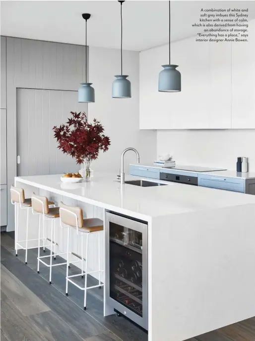  ??  ?? A combinatio­n of white and soft grey imbues this Sydney kitchen with a sense of calm, which is also derived from having an abundance of storage. “Everything has a place,” says interior designer Annie Bowen.