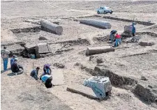  ?? THE ASSOCIATED PRESS ?? Archeologi­sts work in the ruins of a temple for Zeus-Kasios, the ancient Greek god, at the Tell el-Farma archaeolog­ical site in the northweste­rn corner of the Sinai Peninsula.