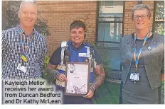  ?? ?? Kayleigh Mellor receives her award from Duncan Bedford and Dr Kathy McLean