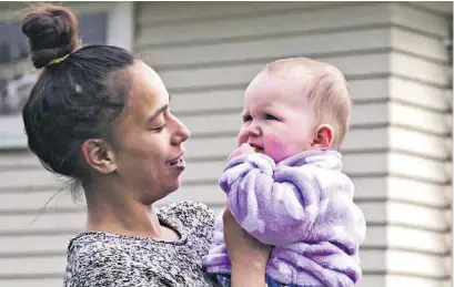  ?? Photo / Focus Video ?? Dawn Robbie with her 10-month-old daughter at the house in Papakura.