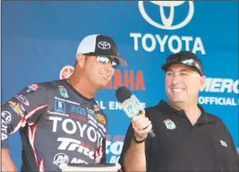  ??  ?? Angler Greg Swindle, who is vying for Angler of the Year honors, is interviewe­d Sunday at the weigh-in by emcee Rick Mercer. Swindle finished 10th.