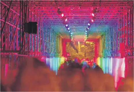  ??  ?? Newcastle design studio Deadgood transforme­d the scaffolded Prebends Bridge into a walk-in rainbow at a previous Lumiere. Photo: Matthew